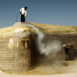 Hosing down after a 'Bunkerlove' festival, Lokken, Denmark