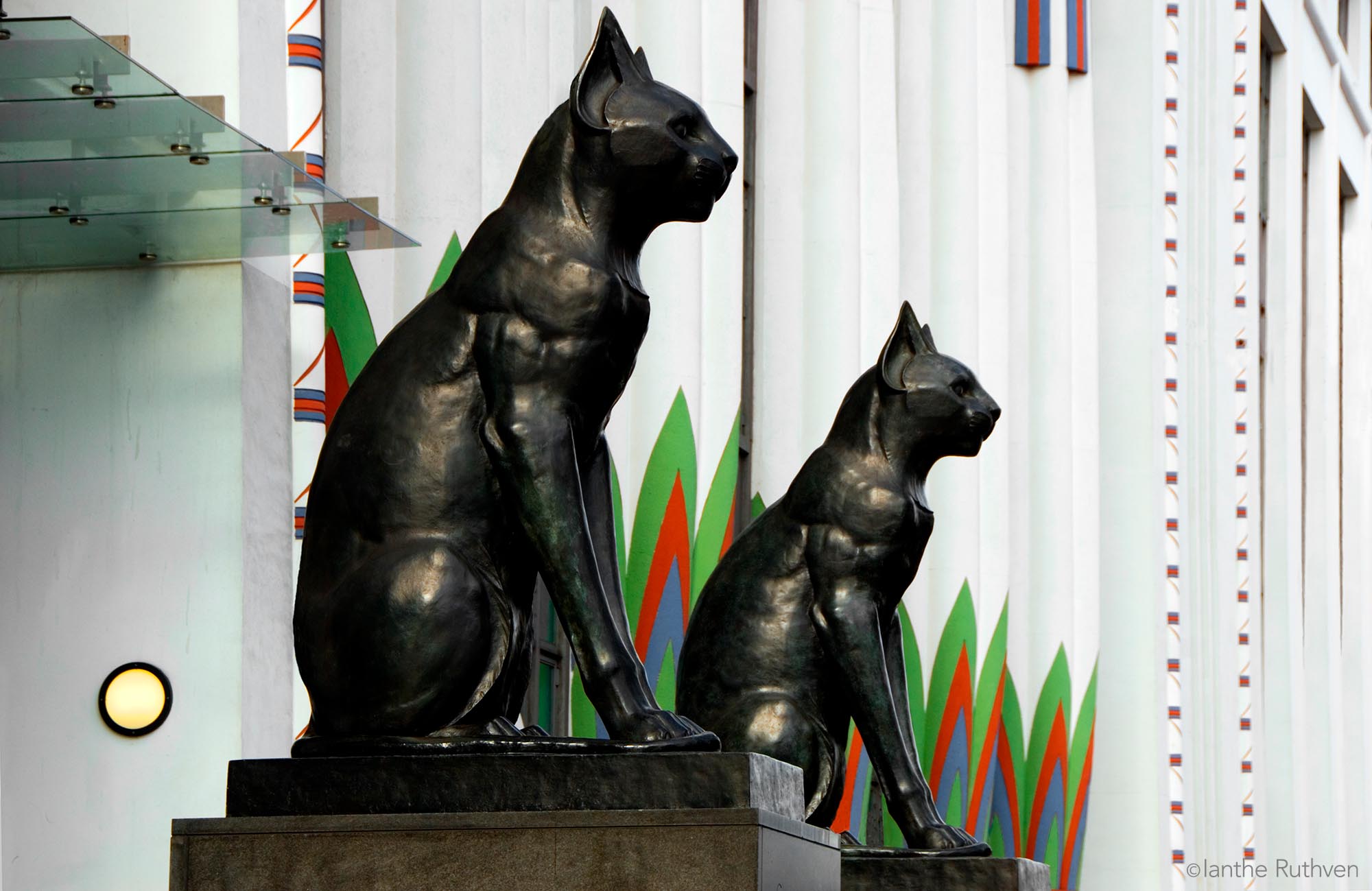 Two large bronze black cats guard the entrance to Greater London House, Mornington Crescent, NW1